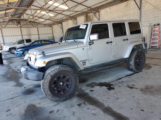 1C4HJWEG1CL104606 - 2012 JEEP WRANGLER U SAHARA SILVER photo 1
