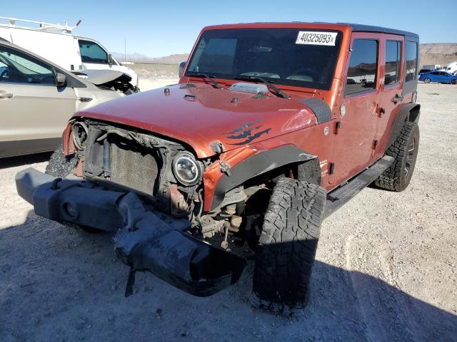 1J4GA59129L770923 - 2009 JEEP WRANGLER U SAHARA ORANGE photo 1