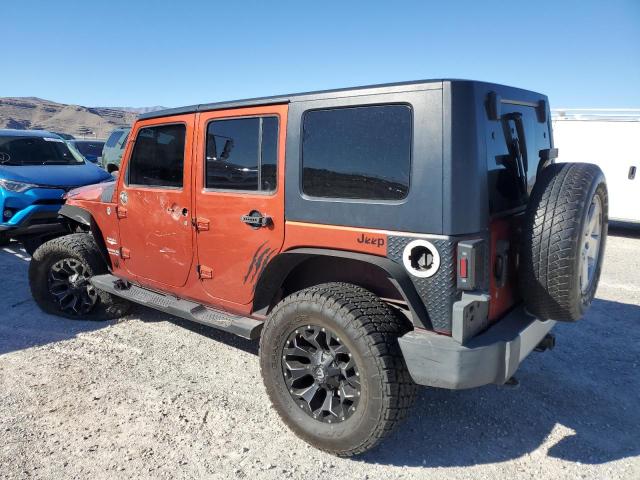 1J4GA59129L770923 - 2009 JEEP WRANGLER U SAHARA ORANGE photo 2