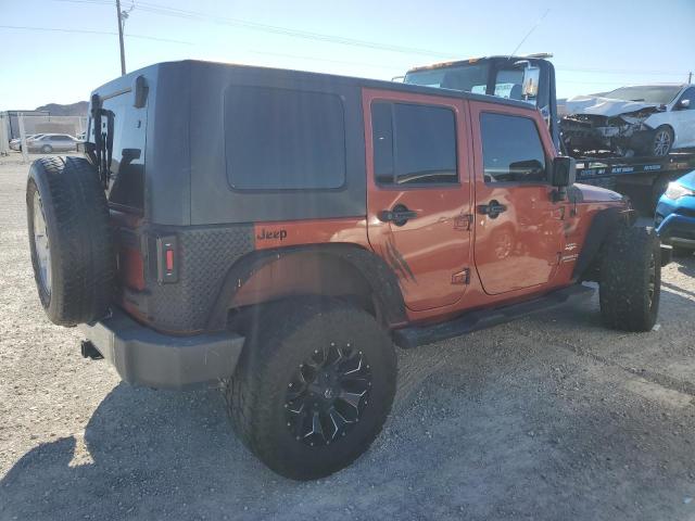 1J4GA59129L770923 - 2009 JEEP WRANGLER U SAHARA ORANGE photo 3