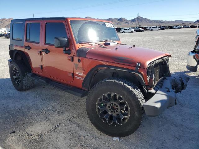 1J4GA59129L770923 - 2009 JEEP WRANGLER U SAHARA ORANGE photo 4