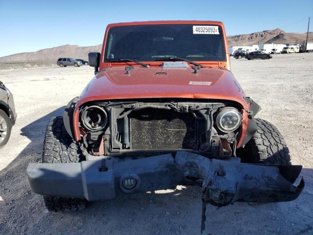 1J4GA59129L770923 - 2009 JEEP WRANGLER U SAHARA ORANGE photo 5