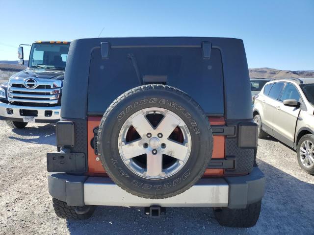 1J4GA59129L770923 - 2009 JEEP WRANGLER U SAHARA ORANGE photo 6