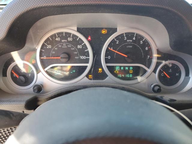 1J4GA59129L770923 - 2009 JEEP WRANGLER U SAHARA ORANGE photo 9