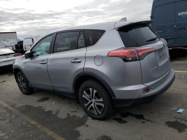 2T3ZFREV7HW392240 - 2017 TOYOTA RAV4 LE SILVER photo 2