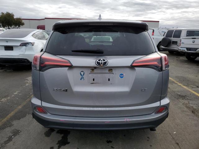 2T3ZFREV7HW392240 - 2017 TOYOTA RAV4 LE SILVER photo 6