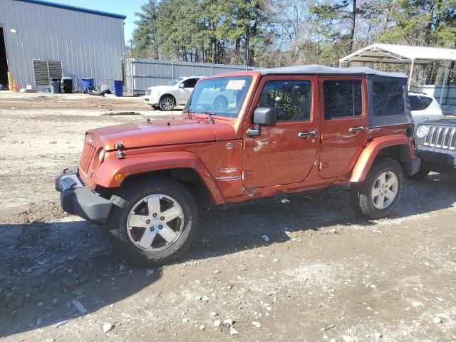 1J4GA59109L783816 - 2009 JEEP WRANGLER U SAHARA ORANGE photo 1