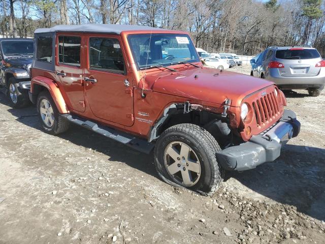 1J4GA59109L783816 - 2009 JEEP WRANGLER U SAHARA ORANGE photo 4