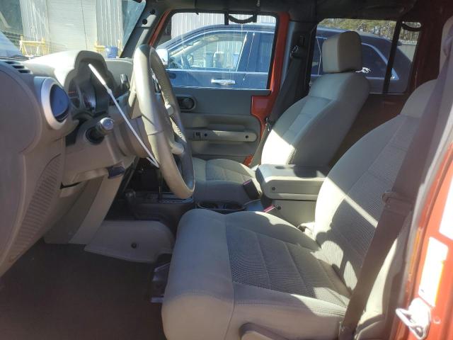 1J4GA59109L783816 - 2009 JEEP WRANGLER U SAHARA ORANGE photo 7