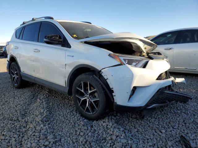 JTMJJREV5JD156992 - 2018 TOYOTA RAV4 HV SE WHITE photo 4