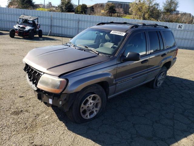 1J4GW48SXYC269248 - 2000 JEEP GRAND CHER LAREDO BROWN photo 1