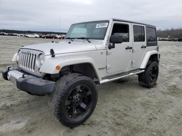 1C4BJWEG9CL260818 - 2012 JEEP WRANGLER U SAHARA SILVER photo 1