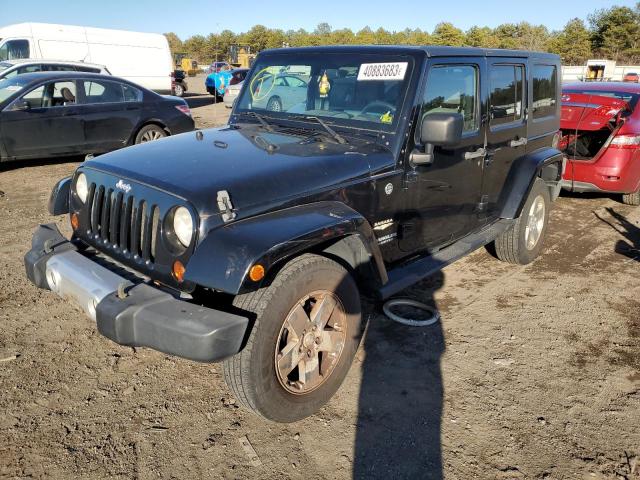 1J4GA59169L775722 - 2009 JEEP WRANGLER U SAHARA BLACK photo 1