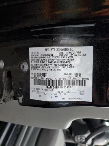 1FAFP34NX5W134277 - 2005 FORD FOCUS ZX4 BLACK photo 13