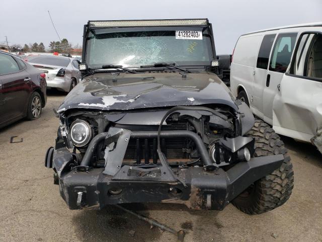 1C4HJWEG3EL210980 - 2014 JEEP WRANGLER U SAHARA BLACK photo 5