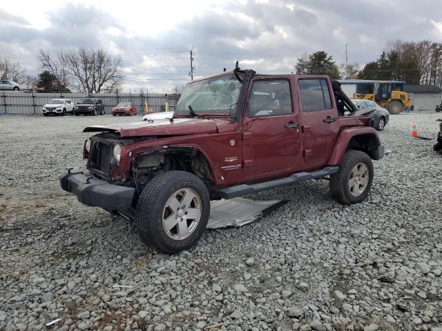 1J4HA5H17AL197527 - 2010 JEEP WRANGLER U SAHARA BURGUNDY photo 1
