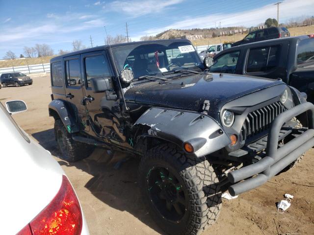 1J4HA5H19AL102577 - 2010 JEEP WRANGLER U SAHARA BLACK photo 4