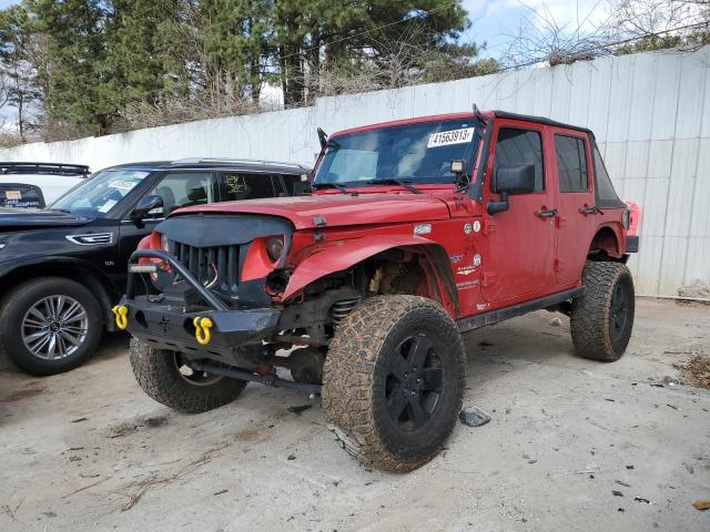 1C4HJWEG9CL121279 - 2012 JEEP WRANGLER U SAHARA RED photo 1