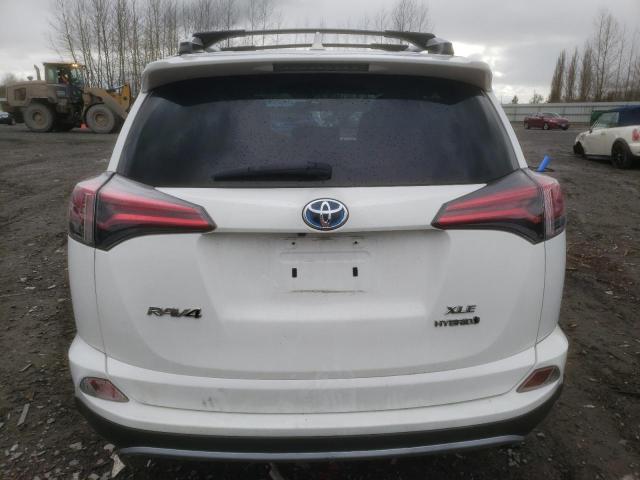 JTMRJREV1GD024419 - 2016 TOYOTA RAV4 HV XLE WHITE photo 6