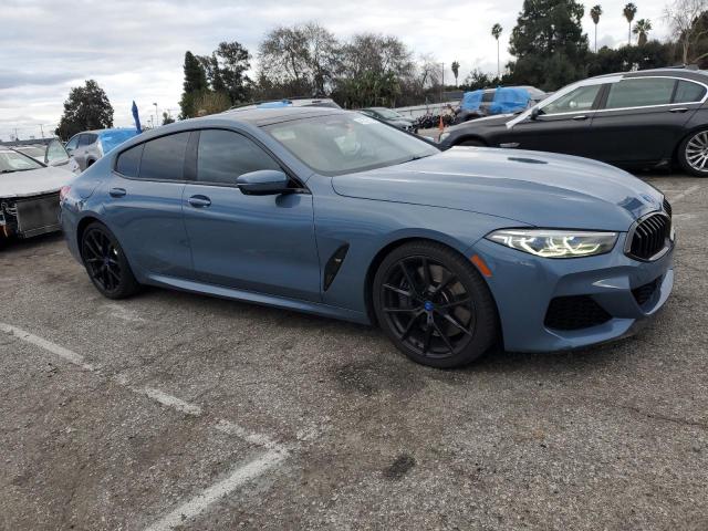 WBAGV8C05MCF03523 - 2021 BMW M850XI BLUE photo 4