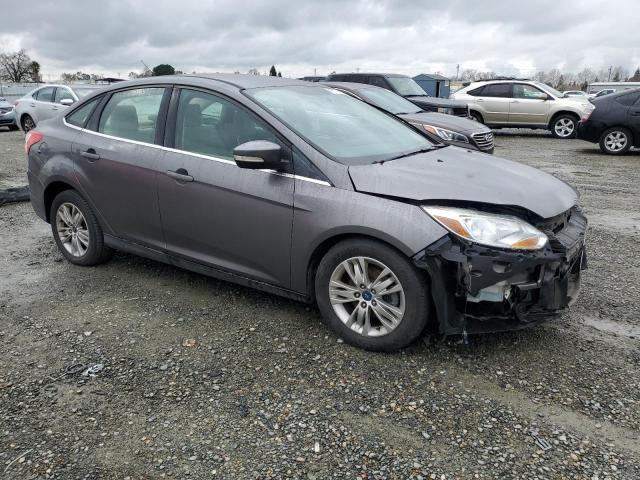1FAHP3H21CL114748 - 2012 FORD FOCUS SEL GRAY photo 4