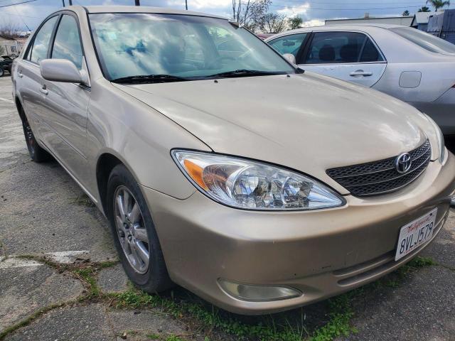 JTDBE32K430155066 - 2003 TOYOTA CAMRY LE GOLD photo 1
