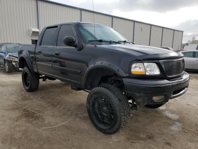 1FTRW08LX1KC12060 - 2001 FORD F150 SUPER BLACK photo 4