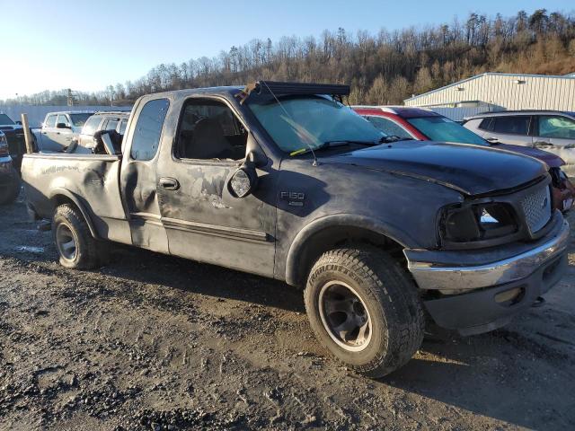 1FTRX18L1XNC02768 - 1999 FORD F150 BLACK photo 4