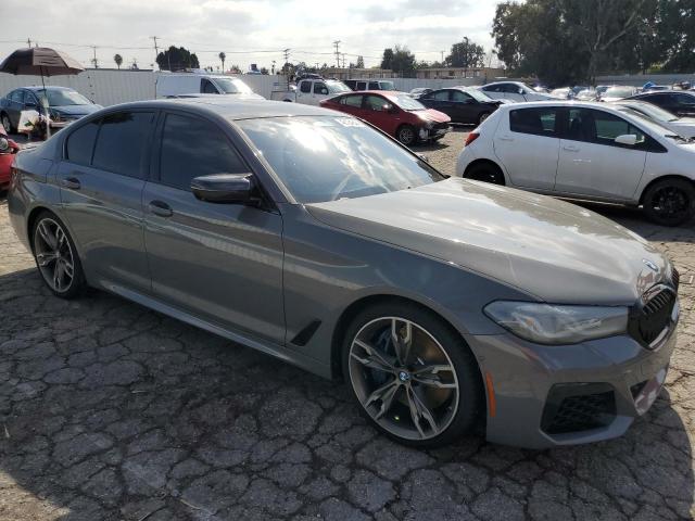 WBA13BK07MCF25372 - 2021 BMW M550XI GRAY photo 4