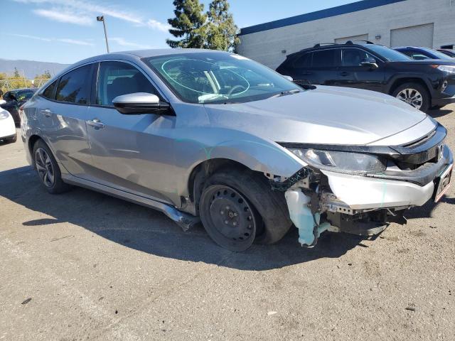 2HGFC2F60MH556174 - 2021 HONDA CIVIC LX SILVER photo 4