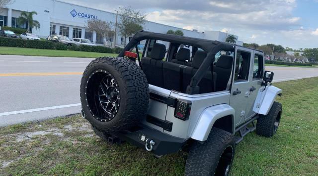 1J4BA5H19BL597855 - 2011 JEEP WRANGLER U SAHARA SILVER photo 4