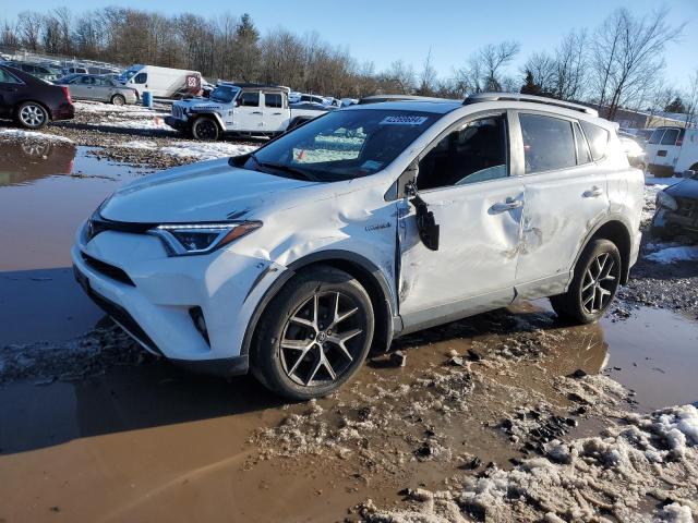 JTMJJREV9JD259445 - 2018 TOYOTA RAV4 HV SE WHITE photo 1