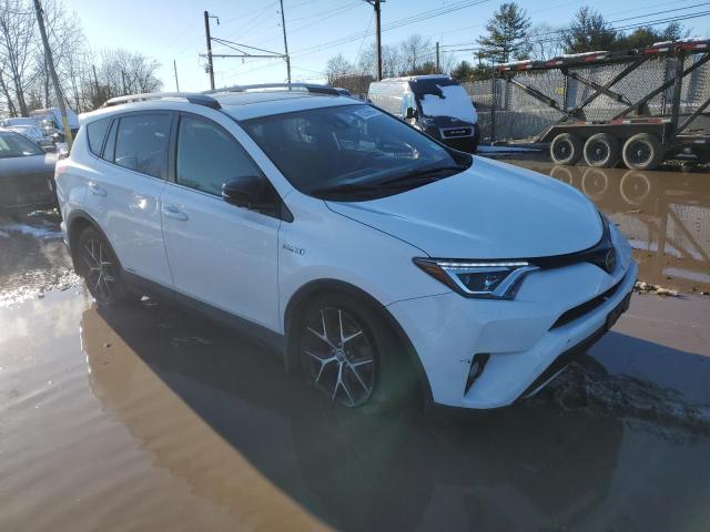 JTMJJREV9JD259445 - 2018 TOYOTA RAV4 HV SE WHITE photo 4