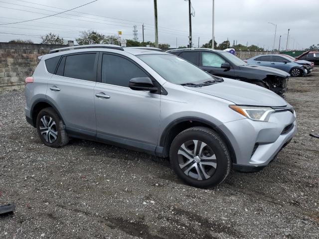 2T3ZFREV9HW389789 - 2017 TOYOTA RAV4 LE SILVER photo 4