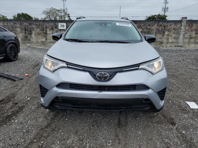 2T3ZFREV9HW389789 - 2017 TOYOTA RAV4 LE SILVER photo 5