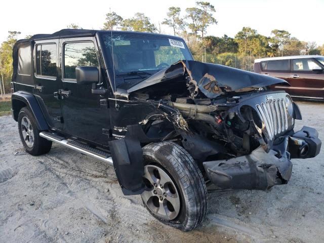 1C4HJWEG4GL178625 - 2016 JEEP WRANGLER U SAHARA BLACK photo 4