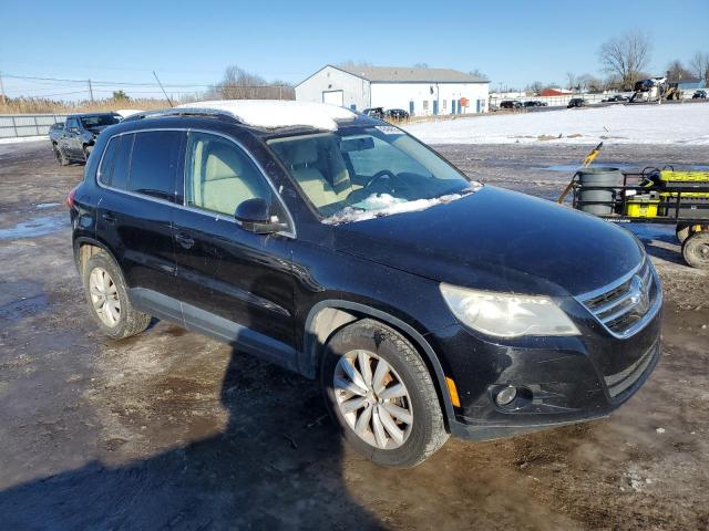 WVGAV7AX8BW526527 - 2011 VOLKSWAGEN TIGUAN S BLACK photo 4