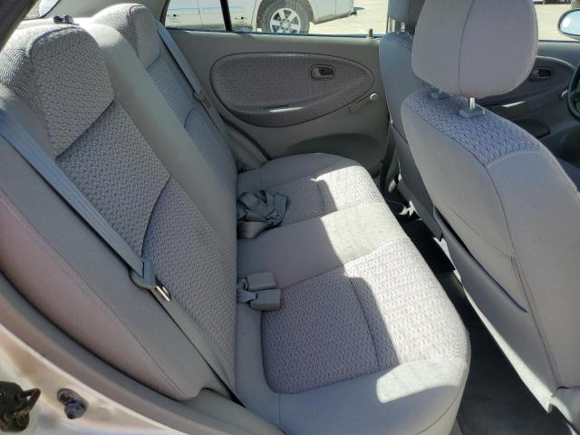 KNADC123426181624 - 2002 KIA RIO SILVER photo 10