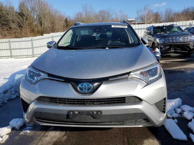 JTMRJREV8JD251386 - 2018 TOYOTA RAV4 HV LE SILVER photo 5