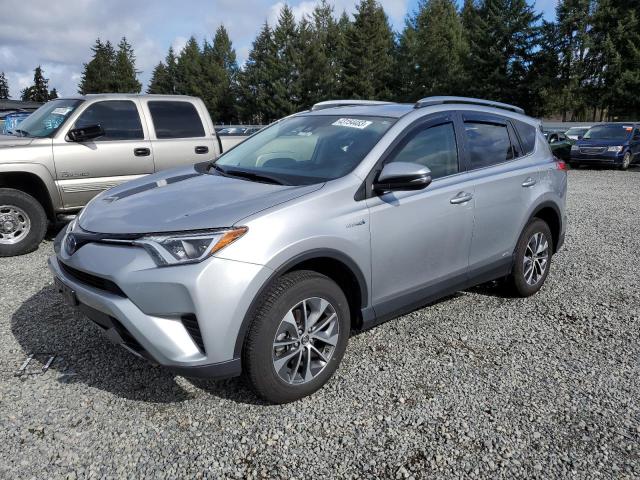 JTMRJREV2JD211241 - 2018 TOYOTA RAV4 HV LE SILVER photo 1