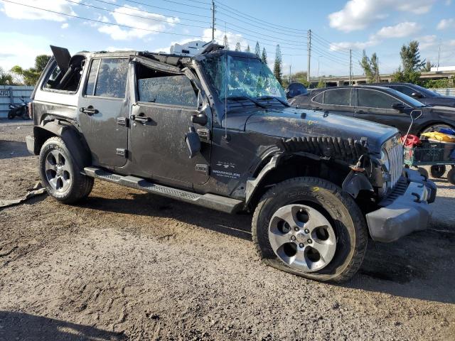 1C4BJWEG0GL304873 - 2016 JEEP WRANGLER U SAHARA BLACK photo 4