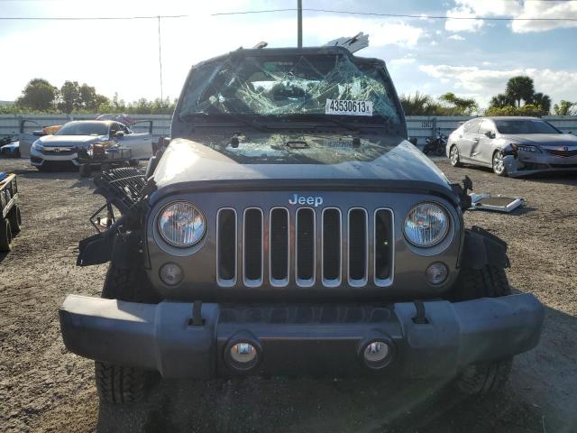 1C4BJWEG0GL304873 - 2016 JEEP WRANGLER U SAHARA BLACK photo 5