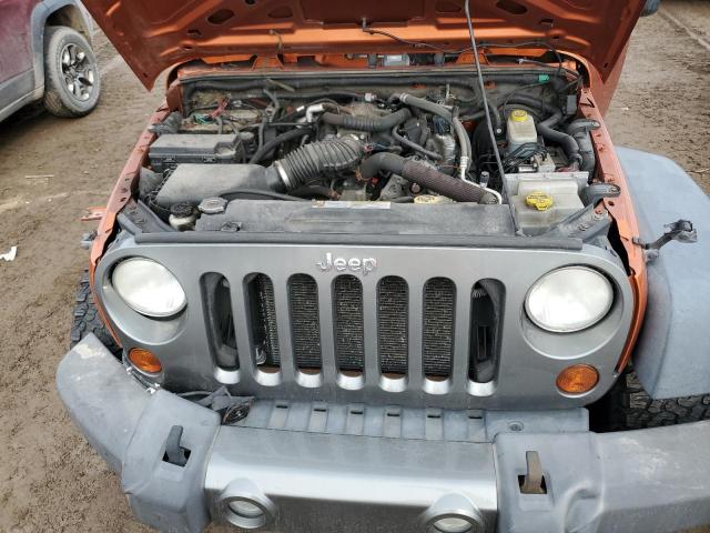 1J4AA2D12AL195805 - 2010 JEEP WRANGLER SPORT ORANGE photo 11