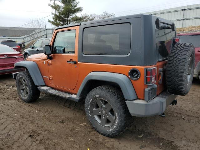 1J4AA2D12AL195805 - 2010 JEEP WRANGLER SPORT ORANGE photo 2