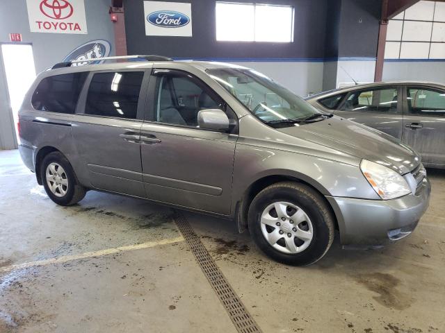 KNDMG4C37A6327861 - 2010 KIA SEDONA LX GRAY photo 4