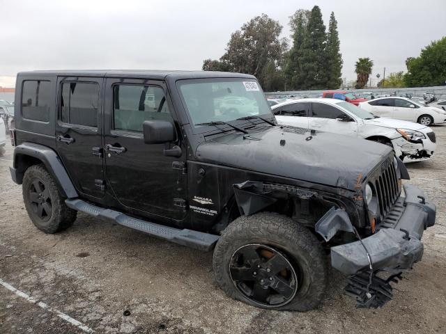 1J4BA5H14AL195062 - 2010 JEEP WRANGLER U SAHARA BLACK photo 4