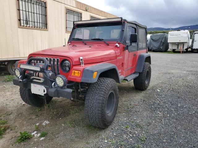 1J4FA49S9YP792410 - 2000 JEEP WRANGLER / SPORT RED photo 2