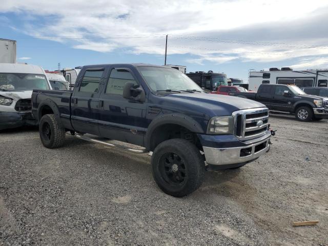 1FTWW31P75ED25213 - 2005 FORD F350 SRW SUPER DUTY BLUE photo 4