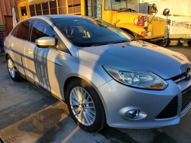1FAHP3H2XCL454271 - 2012 FORD FOCUS SEL SILVER photo 1