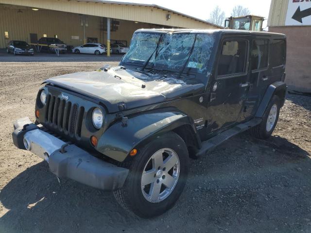 1J4HA5H13AL129614 - 2010 JEEP WRANGLER U SAHARA GREEN photo 1